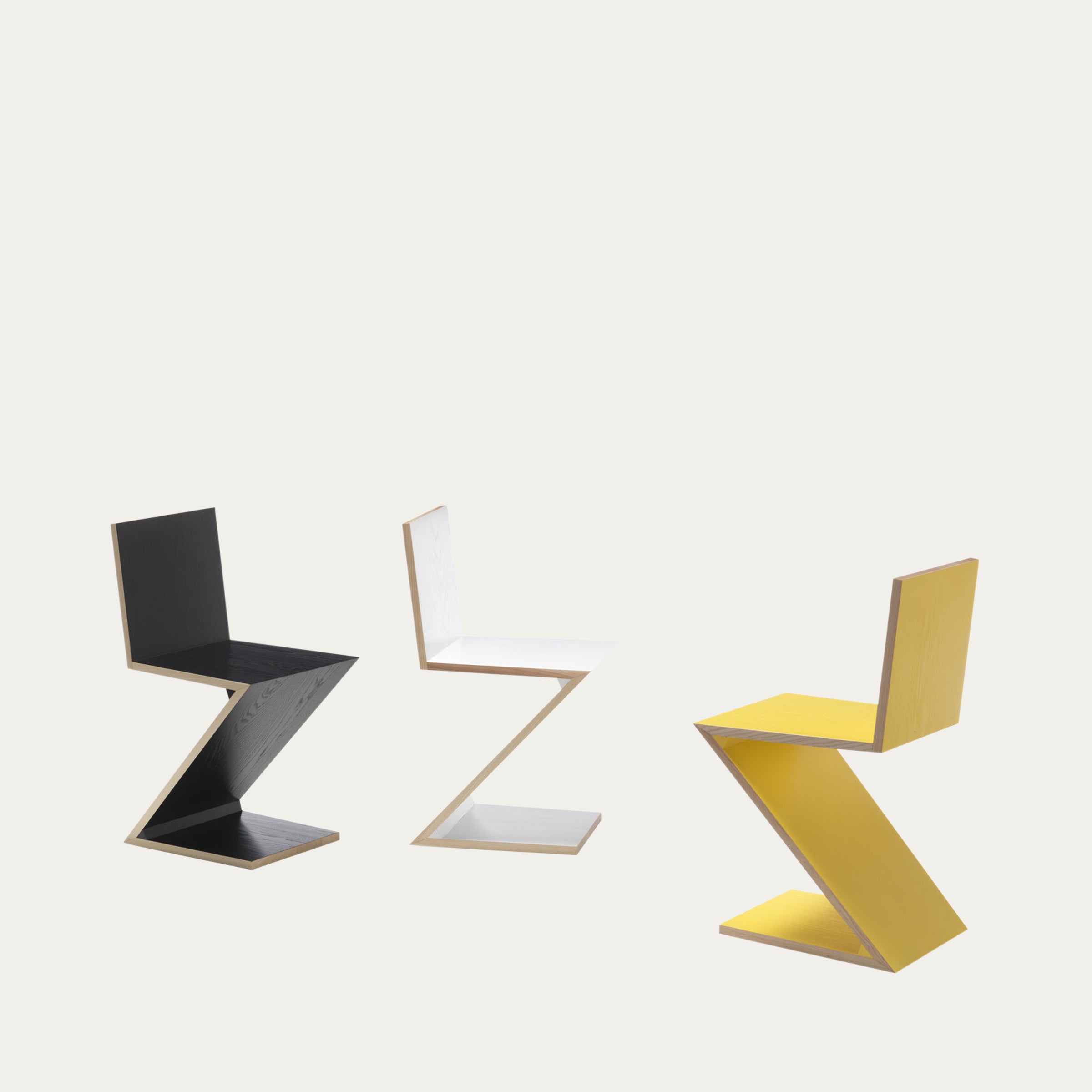 Drei Zig Zag Stühle von Gerrit Thomas Rietveld in Schwarz, Weiß und Gelb – ikonisches Z-förmiges Stuhldesign von 1934